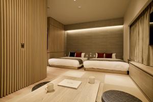 Cama ou camas em um quarto em fav HIROSHIMA HEIWAODORI