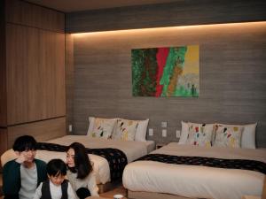Cama ou camas em um quarto em fav HIROSHIMA HEIWAODORI