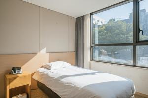Postel nebo postele na pokoji v ubytování Hotel Zinc + 37 fotografií