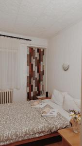 a bedroom with a large bed and a window at Hotel Konaciste Goc Trstenik in Trstenik