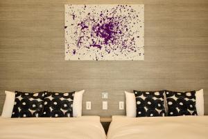 Cama ou camas em um quarto em fav HIROSHIMA HEIWAODORI