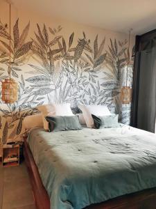 Postel nebo postele na pokoji v ubytování Kaz C2C - Une maison Balinaise avec jacuzzi