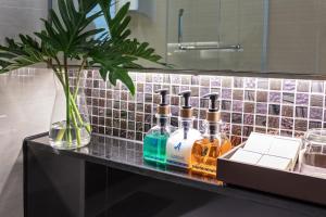 a counter with four bottles of alcohol on it at Adelphi Forty-Nine in Bangkok