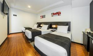 Un pat sau paturi într-o cameră la Hotel Classic