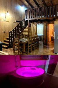 a pink bath tub in a room with a table at Casa rural Alcala Cabaña Del herrero in Alcalá del Júcar