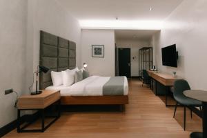 TV a/nebo společenská místnost v ubytování El Sancho Hotel