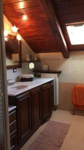a kitchen with a sink and a counter top at Bonne Ville in Cesana Torinese
