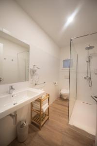 a bathroom with a sink, toilet and shower at Apuntadores 8 in Palma de Mallorca