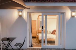 a room with a door leading to a bedroom at Essenwood House in Durban