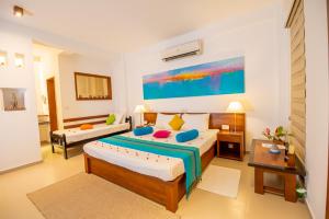 Voodi või voodid majutusasutuse The Residence Hikkaduwa toas