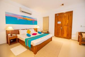 Voodi või voodid majutusasutuse The Residence Hikkaduwa toas