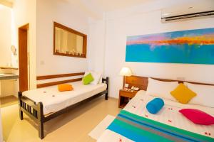 Voodi või voodid majutusasutuse The Residence Hikkaduwa toas