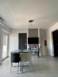A television and/or entertainment centre at Korona Apartman Balatonboglár