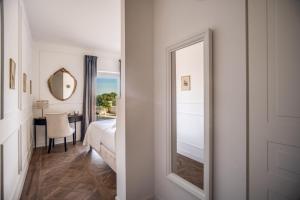 A bed or beds in a room at Vigna Caio Relais & Spa