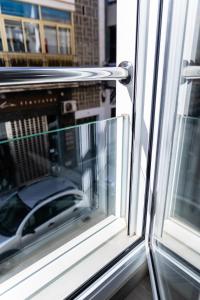 an open window with a view of a car at SAN ANDRÉS 13 in Torre del Mar