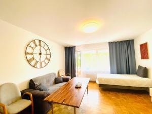 a living room with a couch and a table at Welcome to Messe!-Two-Bedroom Apartment&Balcony in Hannover