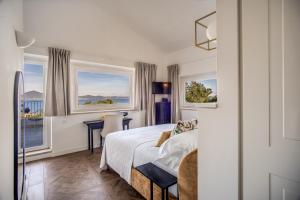 A bed or beds in a room at Vigna Caio Relais & Spa