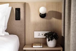 Postel nebo postele na pokoji v ubytování Strand Suites by NEU Collective + 17 fotografií