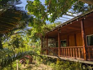 a wooden house in the middle of a forest at Kim's Garden in Con Dao