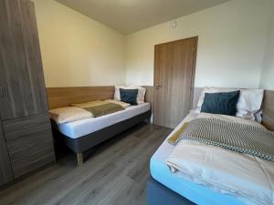 Posteľ alebo postele v izbe v ubytovaní Apartmány Friends Tatry