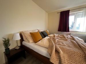 Posteľ alebo postele v izbe v ubytovaní Apartmány Friends Tatry