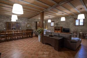 a large living room with a couch and a table at Casa Rural Namasté con SPA in Lleida