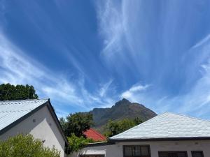 a view of a mountain from a house with a roof at Studio Flatlet on Montreal in Cape Town
