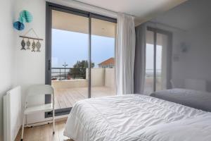 Posteľ alebo postele v izbe v ubytovaní Maison d’Architecte Face Mer à la Plaine sur Mer