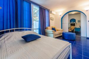 Ένα ή περισσότερα κρεβάτια σε δωμάτιο στο Apartments Mila Banjole