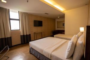 Postel nebo postele na pokoji v ubytování Citrus Hotel Johor Bahru by Compass Hospitality