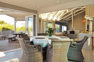 a dining room with a table and chairs at Glentana Beach Rental in Groot Brak Rivier