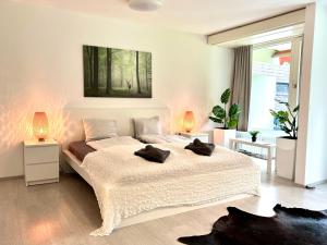 Ένα ή περισσότερα κρεβάτια σε δωμάτιο στο Jutta Deluxe Apartment #325 +22 φωτογραφίες