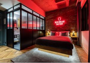 a bedroom with a bed with a red sign on it at BrewDog DogHouse Manchester in Manchester