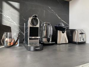 a kitchen counter with several appliances on a counter top at A 2 pas de la croisette in Cannes