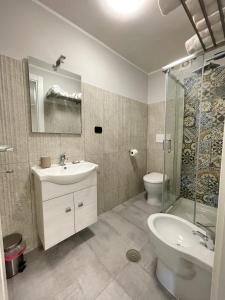 Koupelna v ubytování ALDIVA ROOMS