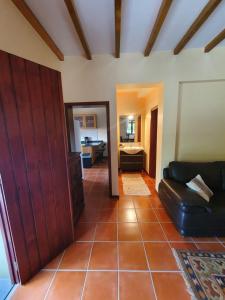 a living room with a couch and a table at Mountain-Ocean-View Madeira in São Vicente