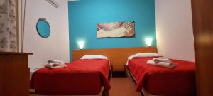 Postel nebo postele na pokoji v ubytování Hotel Indicatore + 22 fotografií