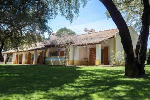 a house with a green lawn in front of it at The Manor House by The Getaway Collection in Grândola