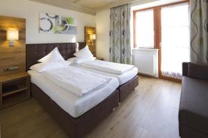 Krevet ili kreveti u jedinici u okviru objekta Hotel Gasthof Obermair