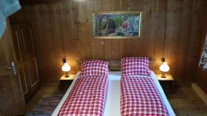 Tempat tidur dalam kamar di Ferienhof Leo