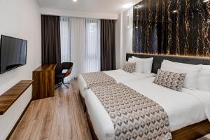Postel nebo postele na pokoji v ubytování Kutaisi Inn + 37 fotografií