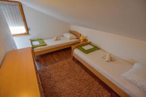 Postel nebo postele na pokoji v ubytování Apartments Kalista