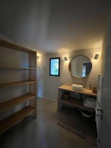 a bathroom with a sink and a mirror at Villa des Mattes - Superbe maison de famille 15 couchages in Crillon-le-Brave
