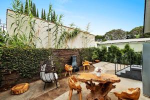a patio with a table and chairs and a fireplace at Culver city 2 bedroom walking distance to downtown unit B in Los Angeles