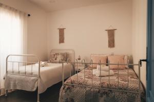 Postel nebo postele na pokoji v ubytování Casa da Bia