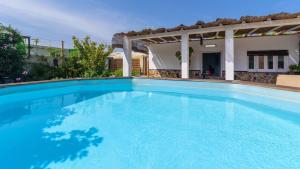 a large swimming pool in front of a house at Casa Amberes Torrox by Ruralidays in Torrox