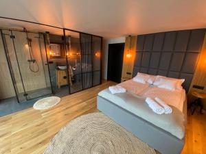 a bedroom with a bed with two towels on it at REWA CZTERY PORY ROKU in Rewa