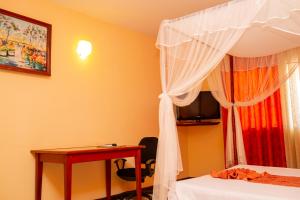 Postel nebo postele na pokoji v ubytování Amazone Hotel Tulear