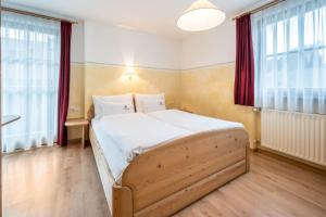 Postel nebo postele na pokoji v ubytování Haus zur Vogelweide App 3
