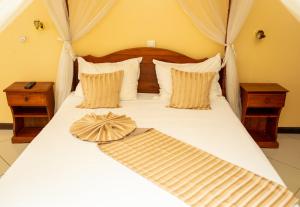 Postel nebo postele na pokoji v ubytování Amazone Hotel Tulear